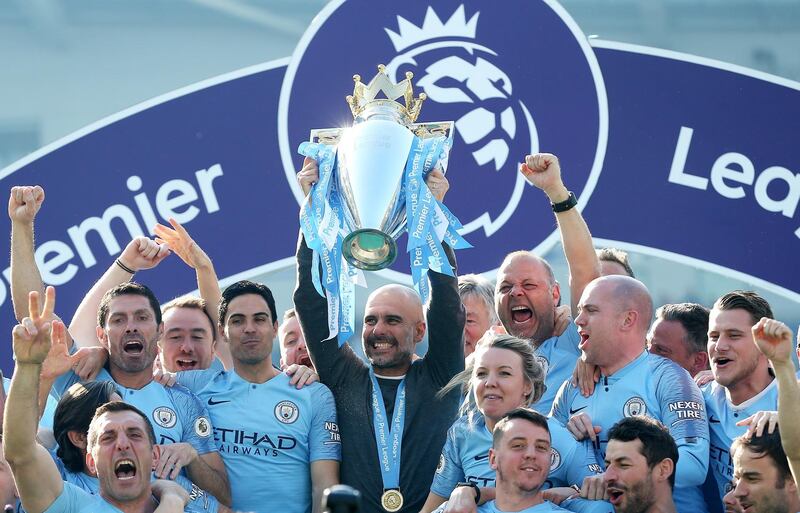 Manchester City players celebrate after beating Brighton 4-1 at the Amex Stadium to be crowned Premier League champions. EPA