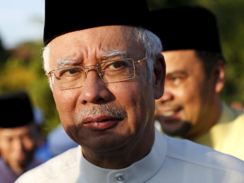 Malaysia's prime minister Najib Razak arrives for a news conference at a mosque outside Kuala Lumpur, Malaysia, July 5, 2015. Najib said on Sunday that he had referred 'wild allegations' against him to lawyers and would decide any legal steps in a few days.  Olivia Harris/Reuters