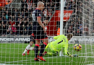 Soccer Football - Premier League - Southampton vs Huddersfield Town - St Mary's Stadium, Southampton, Britain - December 23, 2017   Southampton's Charlie Austin scores their first goal   REUTERS/Peter Nicholls    EDITORIAL USE ONLY. No use with unauthorized audio, video, data, fixture lists, club/league logos or "live" services. Online in-match use limited to 75 images, no video emulation. No use in betting, games or single club/league/player publications.  Please contact your account representative for further details.