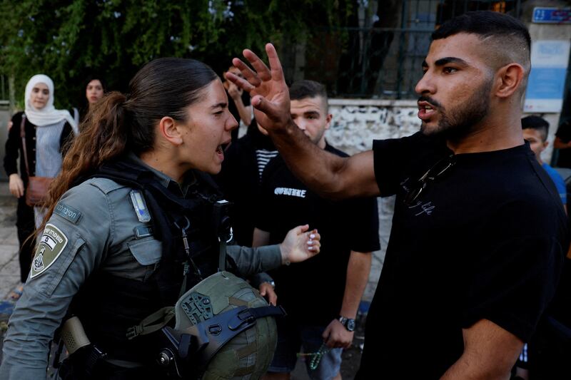 An Israeli police officer shouts at a Palestinian. Reuters