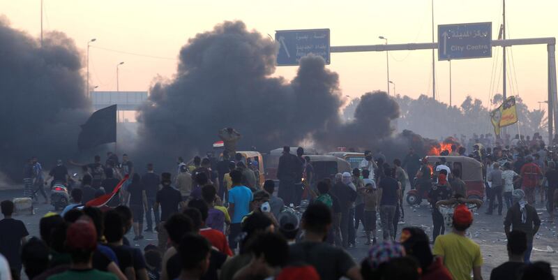 People hold an anti-government protest in Baghdad, Iraq. REUTERS