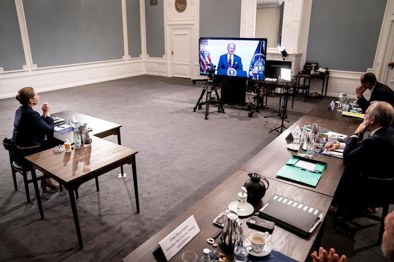 Danish Prime Minister Mette Frederiksen listens to US President Joe Biden during a virtual global climate summit, at The Prime Minister's Office in Copenhagen, Denmark. Reuters