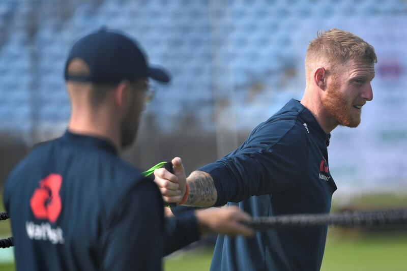 England's Ben Stokes does some stretches. AFP