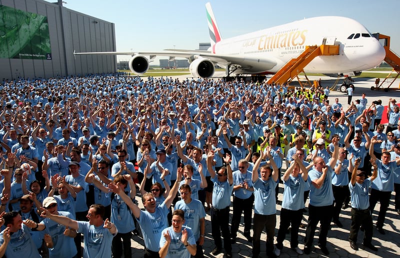 Airbus workers celebrate in front of the Airbus A380 on July 28, 2008 in Hamburg, Germany. The world's largest passenger liner was built for Emirates airline. Getty Images