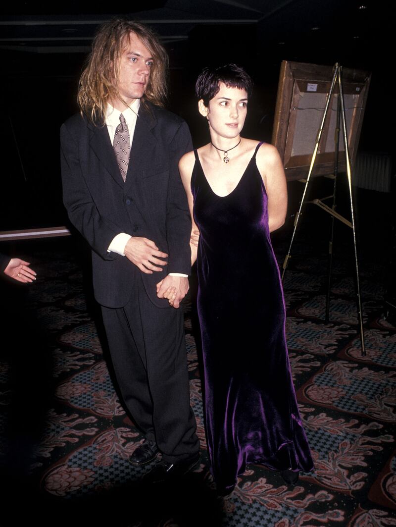 Singer Dave Pirner of Soul Asylum and Winona Ryder, in a deep purple velvet dress attend 'The Age of Innocence' New York City premiere on September 13, 1993 at the Ziegfeld Theatre. Getty