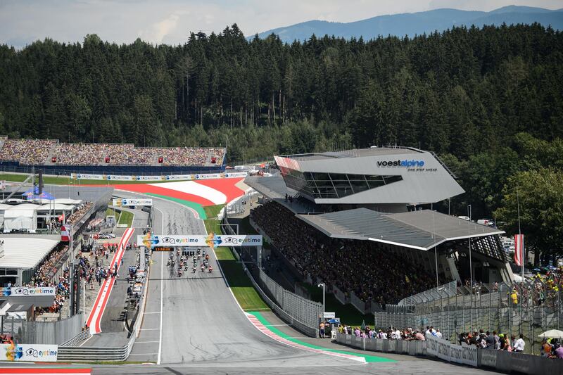General view of the Red Bull Ring's start-finish straight can be seen on this image taken prior to the start of the Austrian MotoGP Grand Prix race in Spielberg, Austria on August 12, 2018. (Photo by Jure Makovec / AFP)