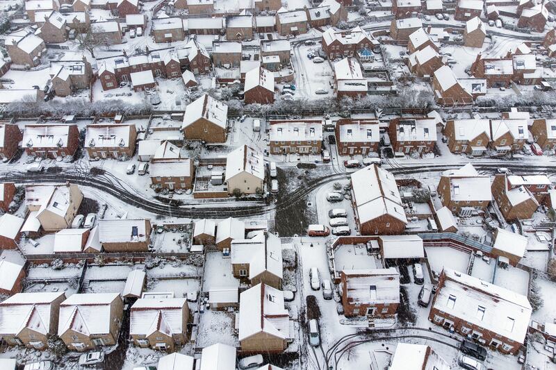 Heavy snow covers houses in Burton Latimer, Northamptonshire. PA
