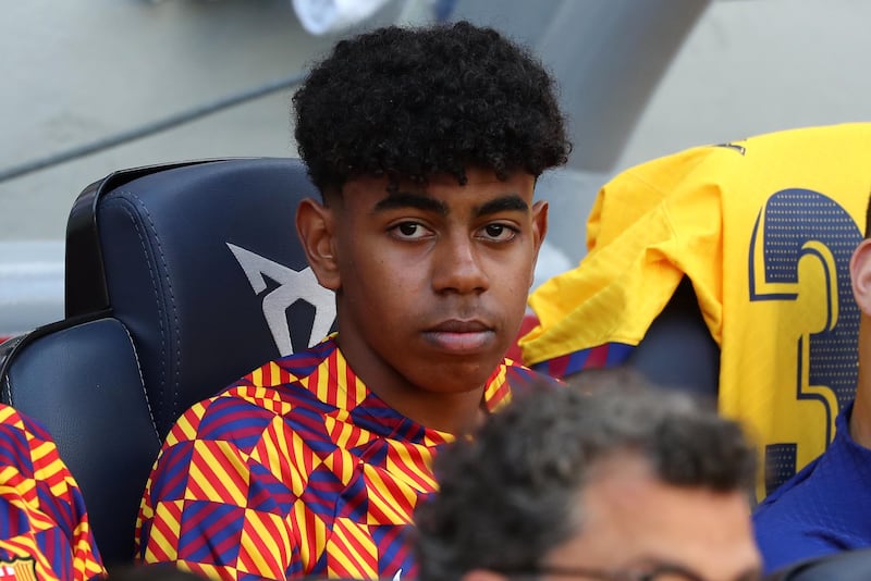 Lamine Yamal on the substitute's bench during Barcelona's match against Atletico Madrid at Camp Nou, on 23 April 2023. Getty
