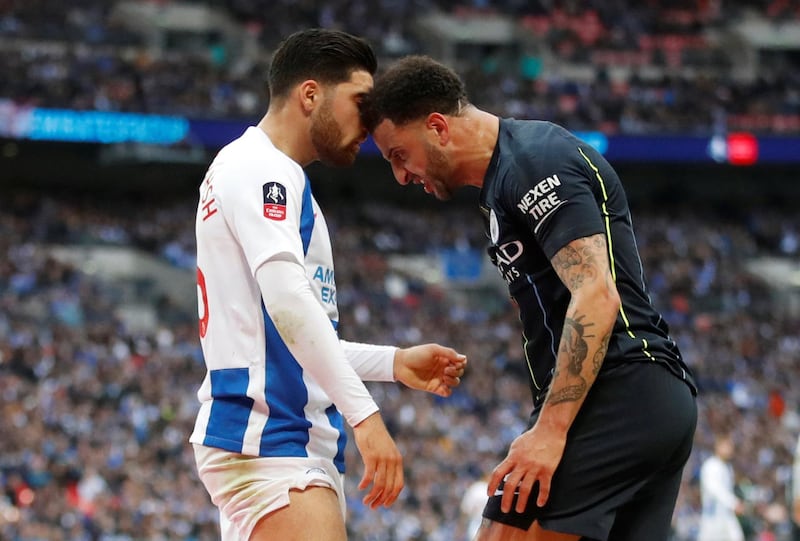 Brighton's Alireza Jahanbakhsh clashes with Manchester City's Kyle Walker. Reuters