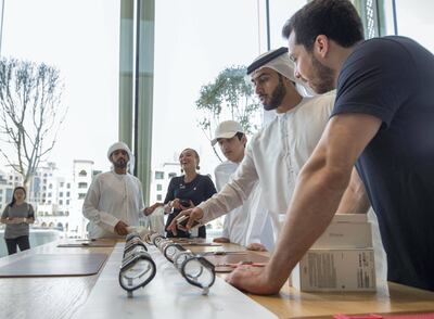 DUBAI, UNITED ARAB EMIRATES, 21 SEPTEMBETR 2018 - iPhone fans checking the new Apple watch series 4 as well at the launch of iPhone XS at Apple store, Dubai Mall.  Leslie Pableo for The National for Alkesh Sharma’s story