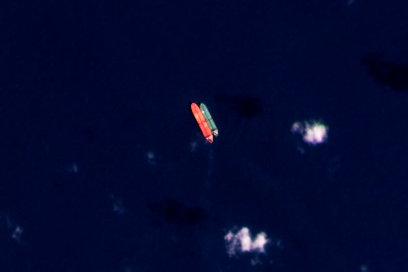 A satellite image shows vessels identified as the Virgo, left, and the Suez Rajan in the South China Sea in February last year. AP