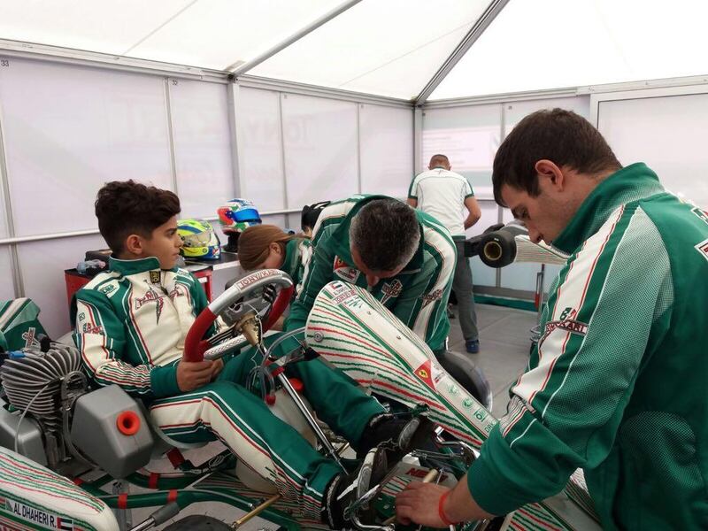 Rashid Al Dhaheri sits on his Tony Kart Racing Team kart as mechanics work on it. Handout image