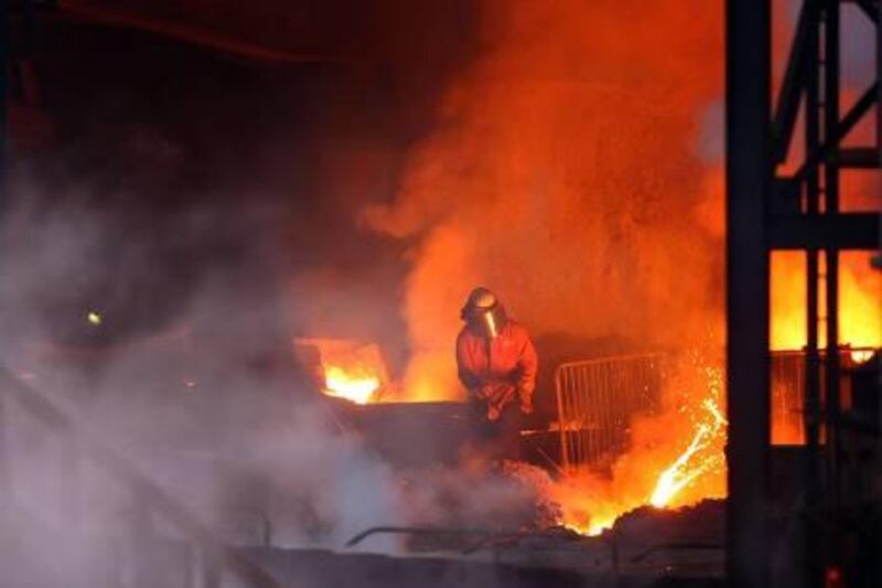 REDCAR, UNITED KINGDOM - JANUARY 15:  A foundryman works with molten metal at the furnace face inside the Corus Steelworks at Redcar which is to be mothballed with the loss of 1700 steelworkers jobs on January 15, 2010 in Redcar, United Kingdom. Corus has begun to mothball the Redcar Steel Plant on February 19, 2010.  (Photo by Christopher Furlong/Getty Images) *** Local Caption ***  GYI0059663736_2.jpg