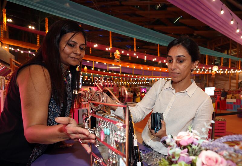 Meeta, right, shops at BurJuman Mall's Diwali Bazaar. Chris Whiteoak / The National