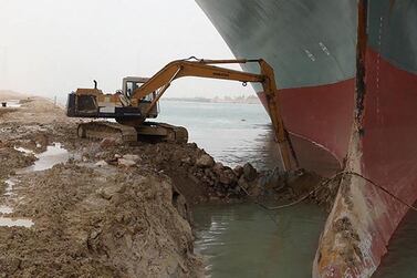 Abdallah Abdelgawad working in his excavator at the spot where the ‘Ever Given’ container ship ran aground on the Suez Canal’s eastern bank. Abdallah Abdelgawad