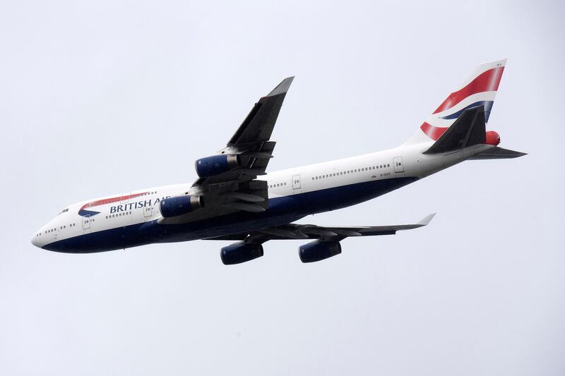 A British Airways Boeing 747 aircraft makes a flypast over  London Heathrow airport on it's final flight, in London on October 8, 2020.  British Airways' last two Heathrow-based Boeing 747 planes have departed from the airport on their final flight. 
The retirement of the airline’s fleet of 747-400 has been brought forward due to the novel coronavirus COVID-19 pandemic. / AFP / JUSTIN TALLIS
