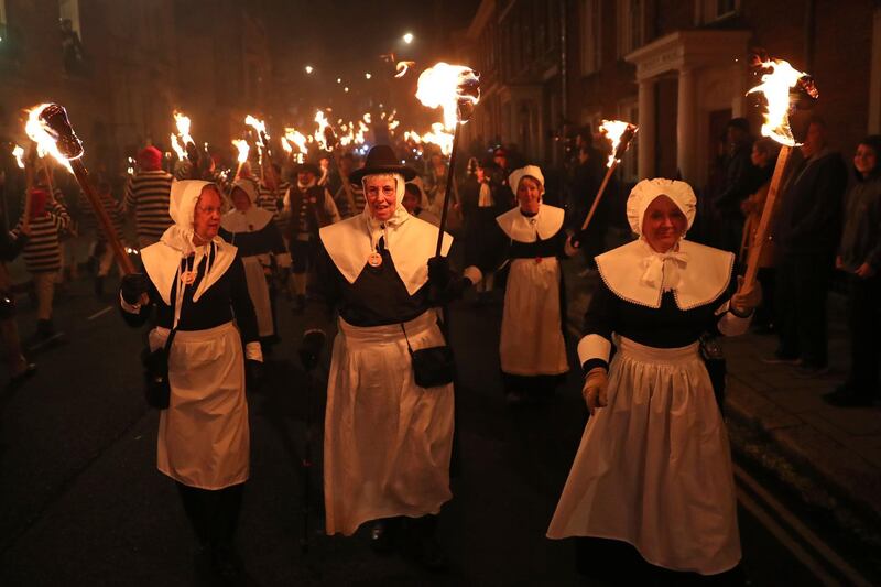 Revellers parade through the streets during the traditional Bonfire Night celebrations. AFP