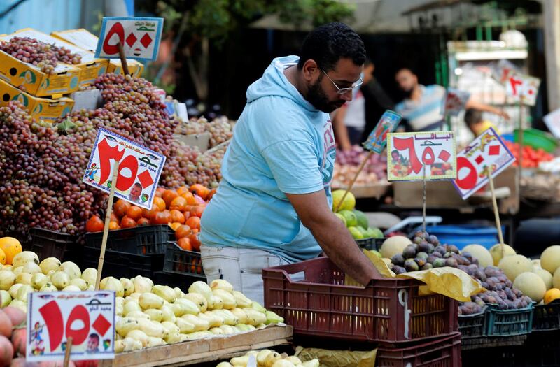 A vendor at the Abbdien Square market in Cairo. The cost of food has risen sharply in the Arab world's most populous nation. Reuters