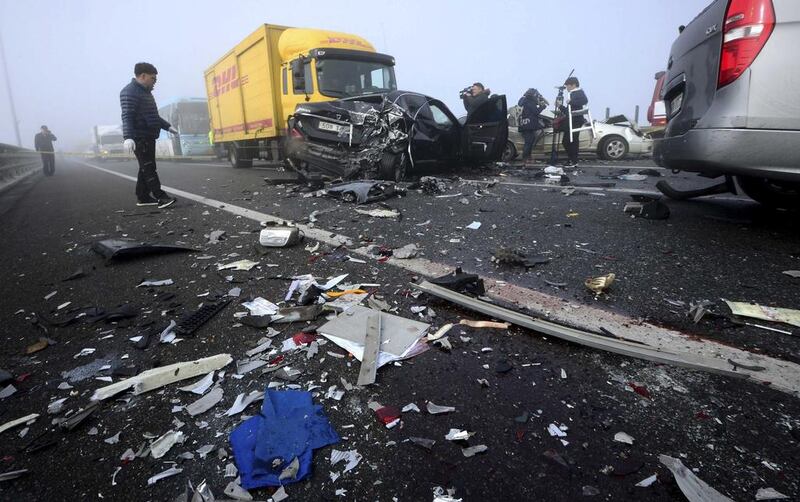 Wreckage is scattered on the road. Park Jung-ho / Reuters