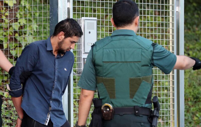 epa06155719 Salah El Karib, 34, one of four arrested in relation to the terrorist attacks in Catalonia, is taken to the Audiencia Nacional court in Madrid, Spain, 22 August 2017. The four suspects will be declaring before the judge in relation to the terrorist attacks in which a total of 15 people died and around 130 were injured when two vehicles crashed into pedestrians in Las Ramblas, downtown Barcelona and on a promenade in Cambrils on 17 August 2017.  EPA/J.J.GUILLEN