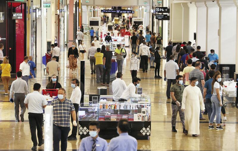 DUBAI, UNITED ARAB EMIRATES , April 29 – 2020 :- Shoppers wearing protective face mask to prevent the spread of the coronavirus at Mall of the Emirates in Dubai. Authorities ease the restriction for the residents in Dubai. At present mall opening timing is 12:00 pm to 10:00 pm. Carrefour timing is 9:00 am to 10:00 pm. (Pawan Singh / The National) For News/Standalone/Online. Story by Patrick