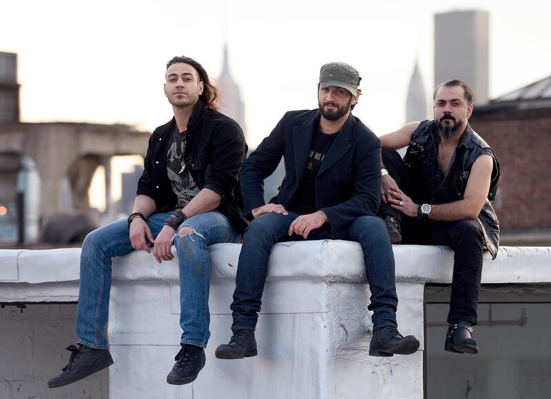 Members of heavy metal band Acrassicauda, from left, guitarist Moe Al Hamawandi, drummer and lyricist Marwan Hussein and singer Faisal Mustafa. Don Emmert / AFP 