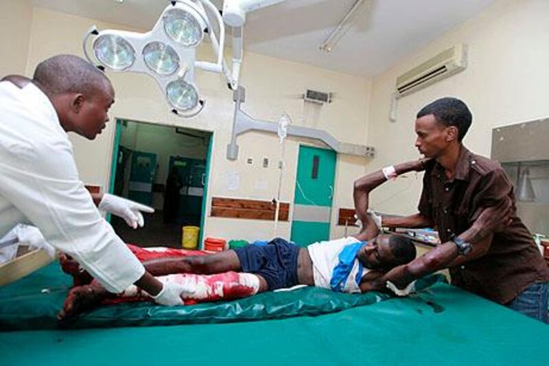A man, injured in a suspected grenade attack, receives treatment at the Coast General Hospital in the Kenyan coastal city of Mombasa May 15, 2012. One person was killed and several were hurt in the attack at a club in Mombasa, police said on Tuesday. REUTERS/Joseph Okanga (KENYA - Tags: CRIME LAW TPX IMAGES OF THE DAY)