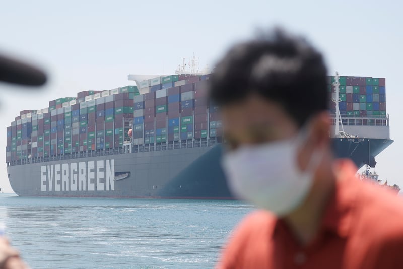 The 'Ever Given', one of the world's largest container ships, sails in the Suez Canal after authorities agreed to a settlement with the vessel's owner and insurers.