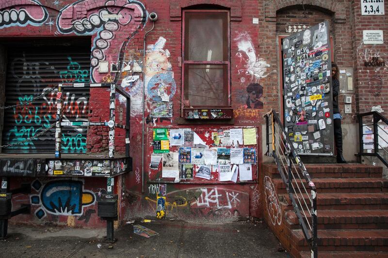 Graffiti and fliers cover the exterior of the building housing the ConsenSys Inc. office in the Brooklyn borough of New York, U.S., on Thursday, March 29, 2018. The employees of ConsenSys Inc., the blockchain startup co-created by Ethereum guru Joseph Lubin, have taken over the space at 49 Bogart Street in the Bushwick neighborhood of Brooklyn. Photographer: Holly Pickett/Bloomberg