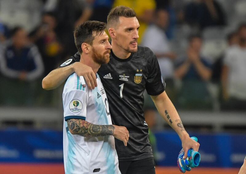 Argentina's Lionel Messi and goalkeeper Franco Armani greet each other after the match. AFP