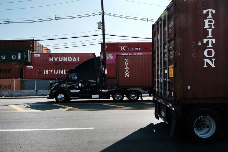 Cargo containers sit inside of a Bayonne port in October in New Jersey. As surging inflation and supply chain disruptions are disrupting global economic recovery, the IMF has projected the global economy will grow by 5. 9 per cent this year – a 0. 1 percentage point lower than its July estimate. AFP