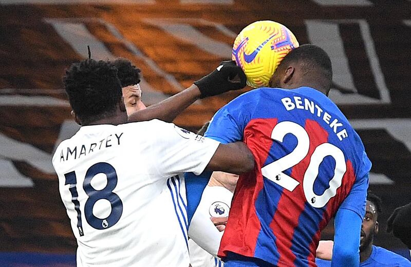 Leicester City's Daniel Amartey, left, appears to handle the ball as Crystal Palace's Christian Benteke attempts a header. PA