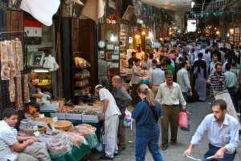 People shop at Souk al-Hamidieh in Damascus' old downtown in preparations for Eid al-Fitr September 29, 2008. Eid al-Fitr marks the end of the Muslim fasting month of Ramadan. REUTERS / Khaled al-Hariri (SYRIA)