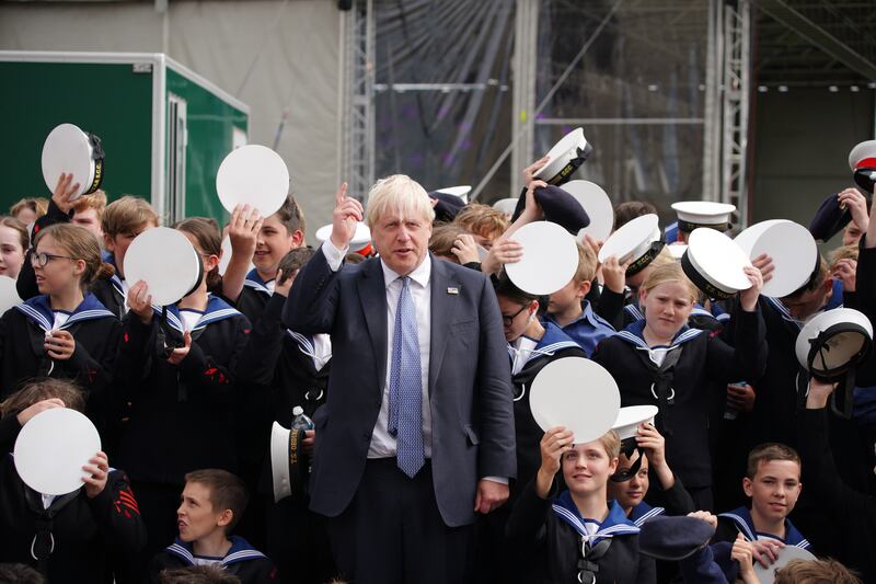 Britain's Prime Minister Boris Johnson poses with Sea Cadets during a visit to BAE systems in Barrow-in-Furness. PA