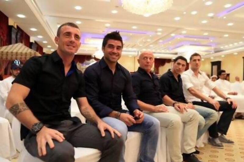Al Wahda’s coach Karel Jarolim, centre with new players, from left,  Damian Diaz, Marco Estrada, Sebastian Tagliabue and Dino Djulbic.