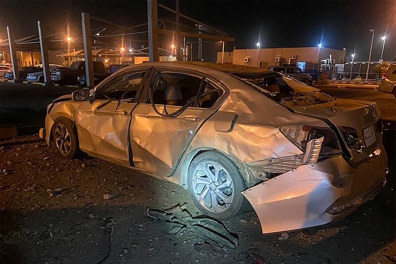 A damaged car at the Aramco oil plant in Jizan.