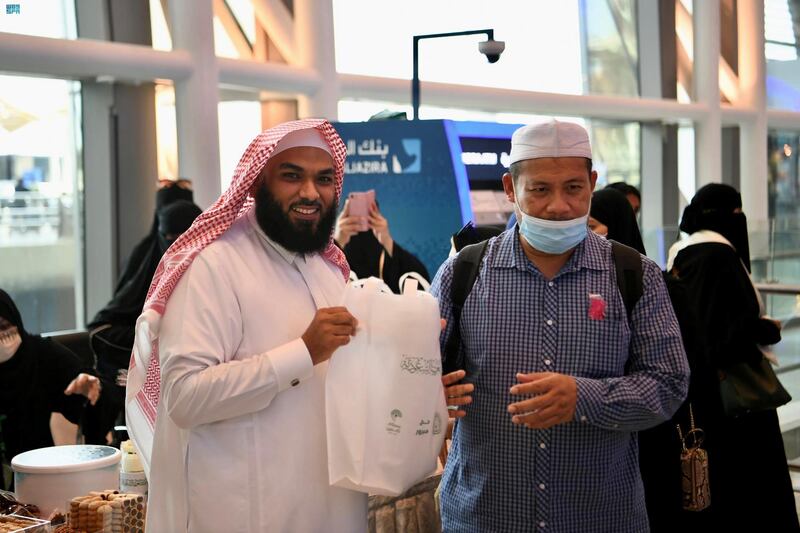 More than 100 volunteers and staff handed out goody bags from Saudi Arabia's Ministry of Islamic Affairs at Jeddah Airport, with treats for pilgrims to remember their Hajj experience. All photos: SPA