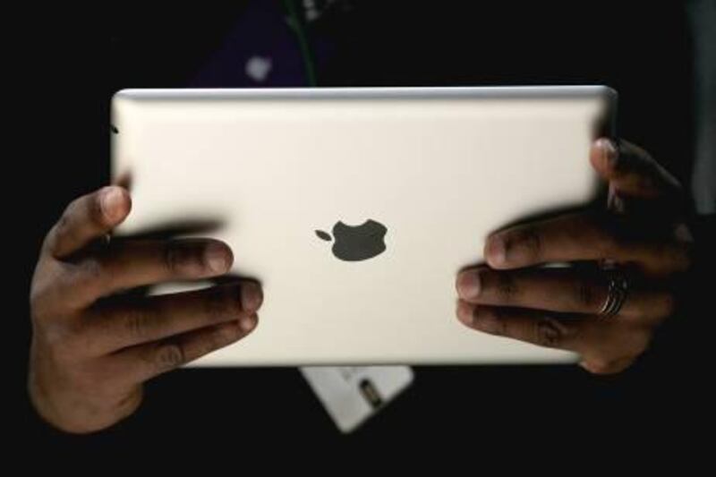 SAN FRANCISCO - MARCH 02: An attendee holds the new iPad 2 during an Apple Special event to unveil the new iPad 2 at the Yerba Buena Center for the Arts on March 2, 2011 in San Francisco, California. Apple CEO Steve Jobs unveiled the iPad 2 as the successor to its popular tablet, the iPad.   Justin Sullivan/Getty Images/AFP== FOR NEWSPAPERS, INTERNET, TELCOS & TELEVISION USE ONLY ==

 *** Local Caption ***  427957-01-09.jpg