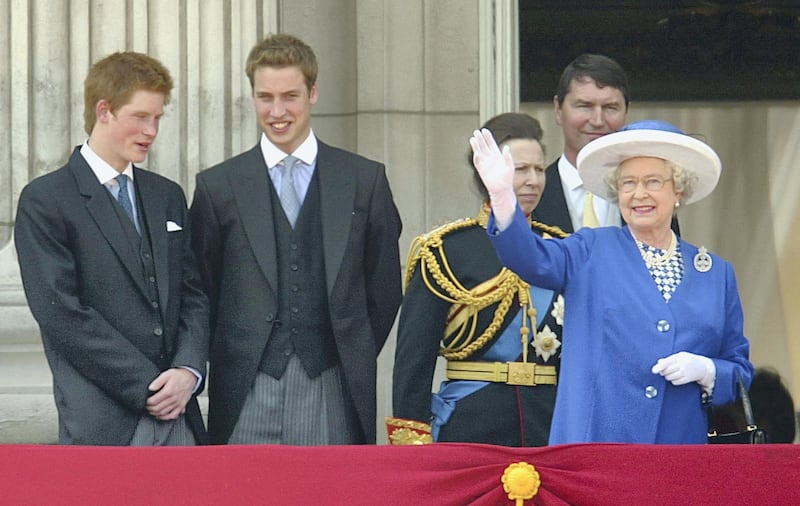 LONDON - JUNE 14:  Britain's Queen Elizabeth II (R) waves to the crowd from the balcony of Buckingham Palace as Prince Harry (L), Prince William (2L) and  Princess Anne (3L) look on after attending the Trooping of the Colour ceremony June 14, 2003 in London, England. The ceremony marks the Queen's official birthday. (Photo by Scott Barbour/Getty Images)