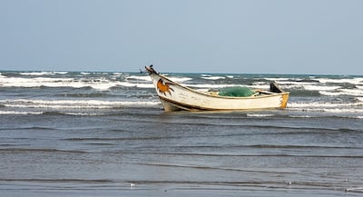 A boat is anchored off a beach in the port city of Aden, Yemen, near the Bab Al Mandeb. EPA