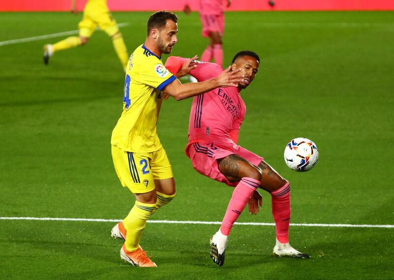 Cadiz's Filip Malbasic in action with Real Madrid's Eder Militao. Reuters