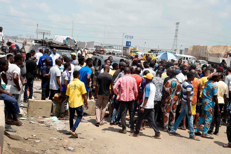 A crowd of protesters barricade the Lagos-Ibadan expressway to protest against police brutality and the killing of protesters by the military, at Magboro, Ogun State. AFP