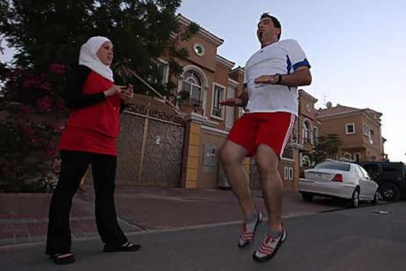 Abrar Mikkawi motivates her husband, Essam al Jamal, to exercise daily so that he controls his weight and blood-sugar levels.