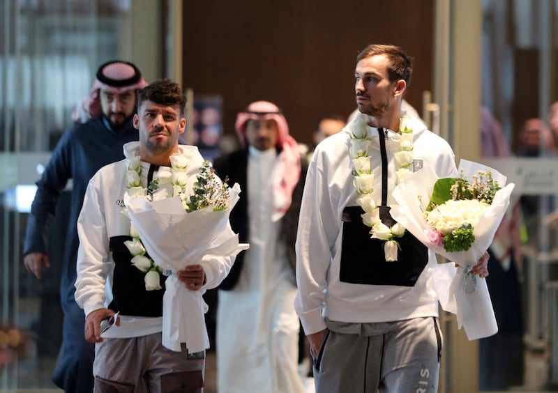 PSG's Juan Bernat and Fabian Ruiz after arriving in Riyadh. Reuters