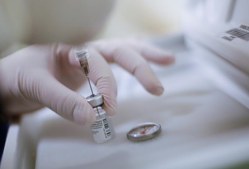 A health worker prepares an injection with a dose of the Pfizer-BioNTech Covid-19 vaccine at the Hospital Infantil in Ciudad Juarez, Mexico. Reuters