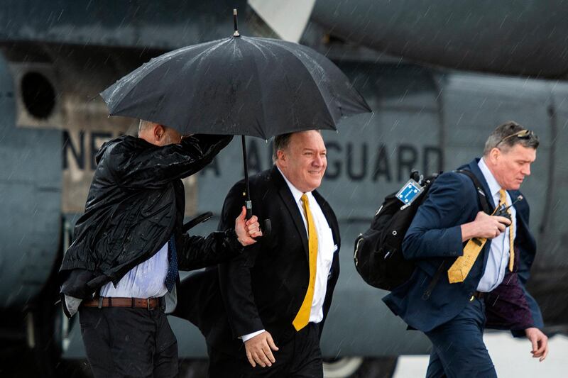 US Secretary of State Mike Pompeo, center, arrives in Erbil, Iraq, Wednesday, Jan. 9, 2019. Pompeo visited Iraq in an unannounced stop on his Mideast tour meant to promote the White House's hard-line position on Iran. (Andrew Caballero-Reynolds/Pool Photo via AP)