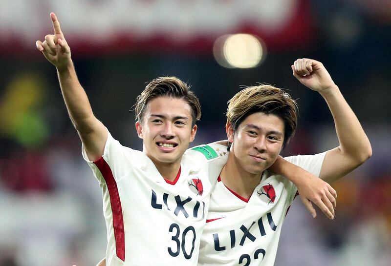 Kashima Antlers' Hiroki Abe celebrates scoring their third goal with Koki Anzai. Reuters