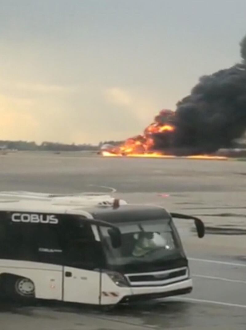 A Sukhoi passenger plane is engulfed in flames after it made an emergency landing due to an onboard fire. Mikhail Norenko via Reuters.