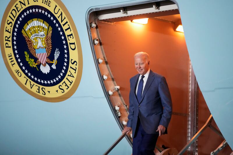 Mr Biden steps off Air Force One at Belfast International Airport. AP