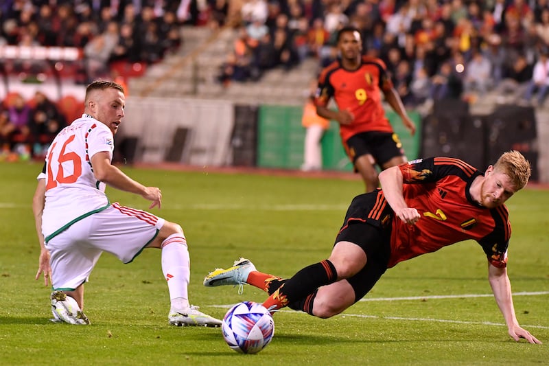 Belgium's Kevin De Bruyne, right, goes down as he fights for the ball against Wales' Joe Morrell. AP Photo
